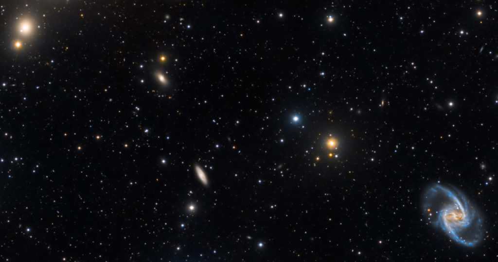Galaxies and stars of various sizes as seen through a space telescope.