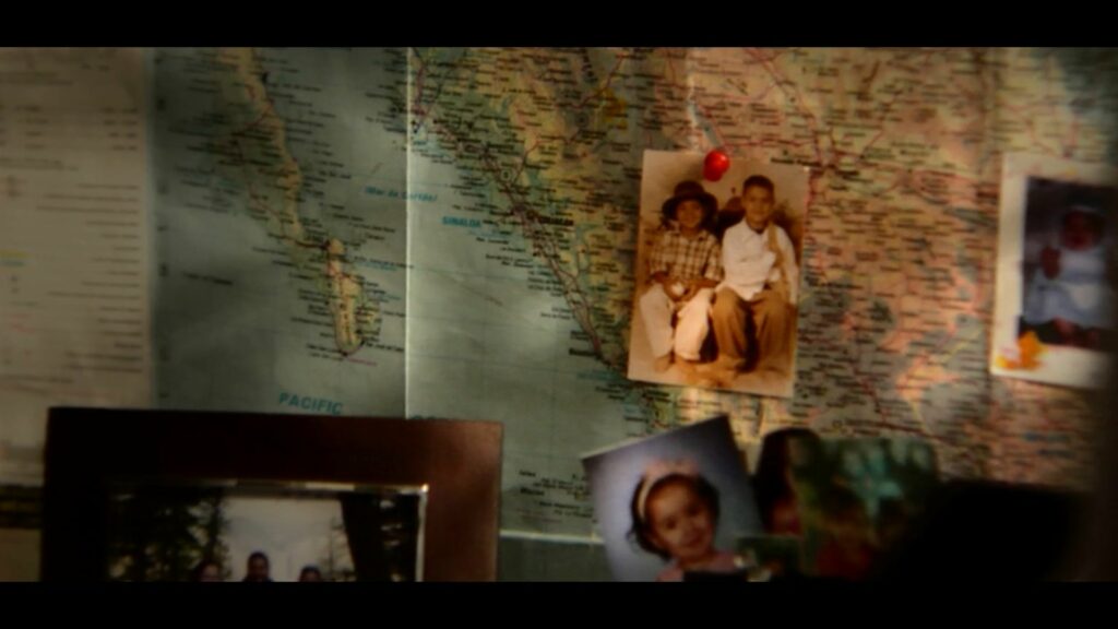 Map with family photos overlaid in front of it.