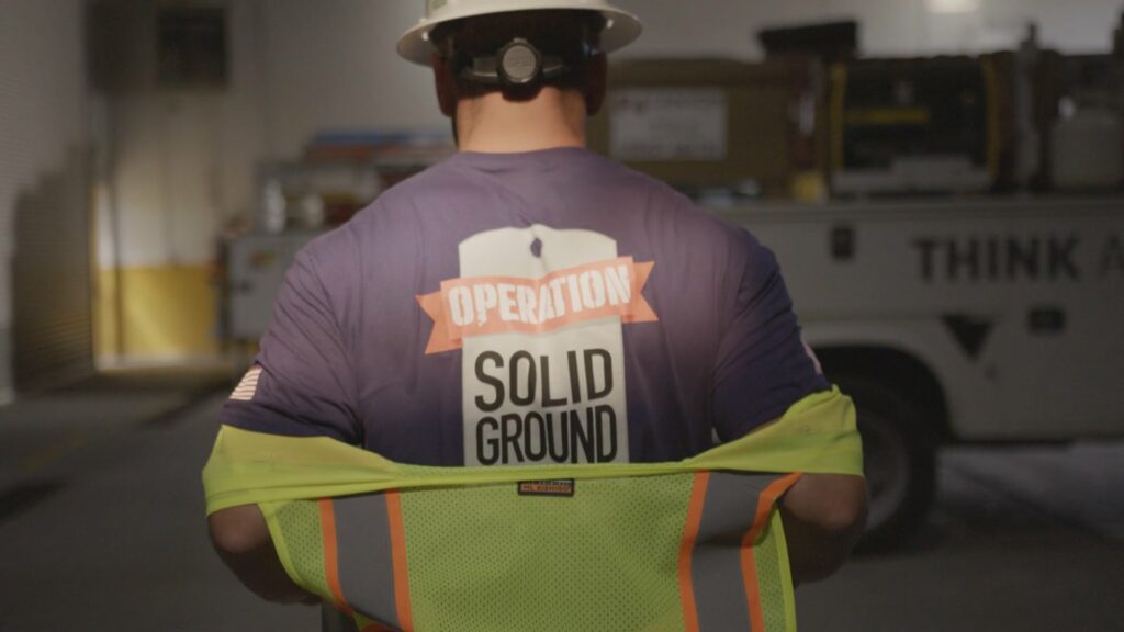 Worker with Solid Ground t-shirt facing forward