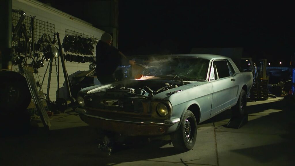 Muscle car at night parked with engine exposed